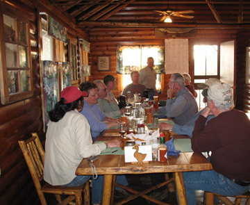Fly fishing group having breakfast at the lodge