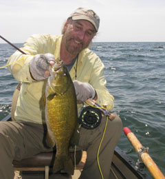 Tim in a canoe with a big smallie
